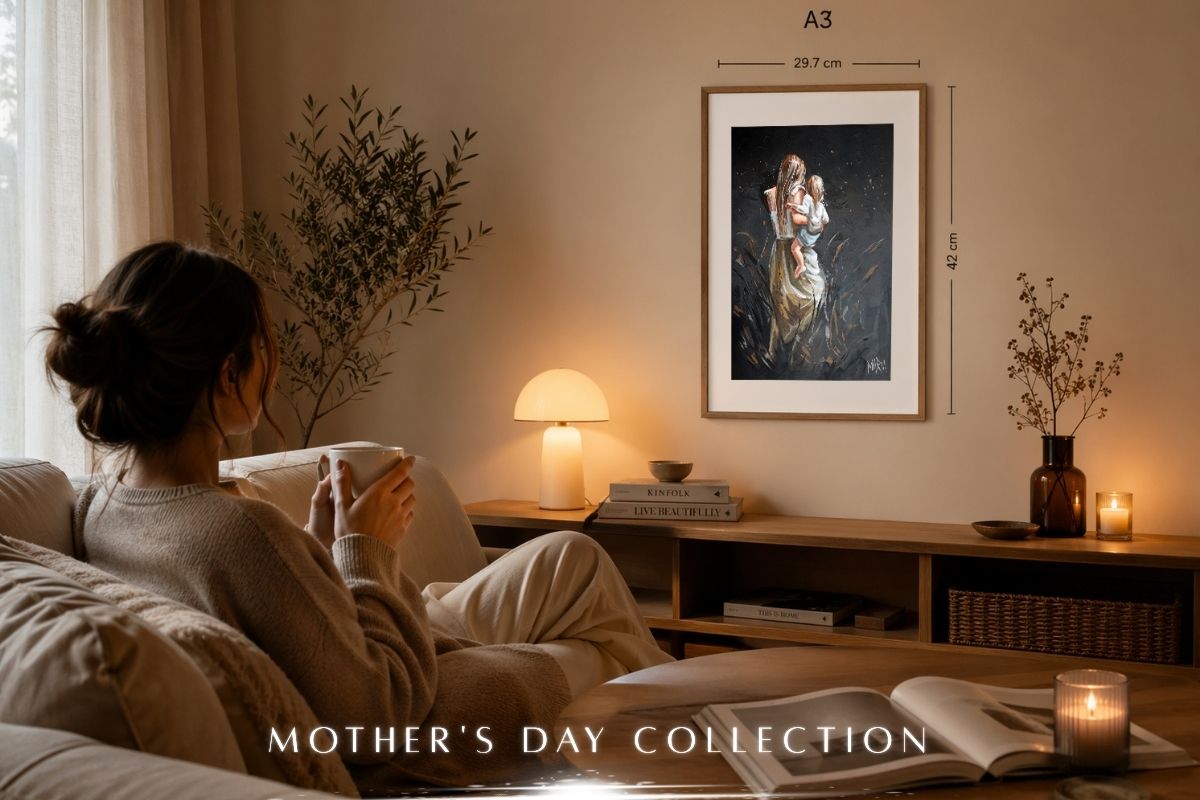 Woman sitting on a couch in a cozy living room with a framed artwork or paper print from Maria
