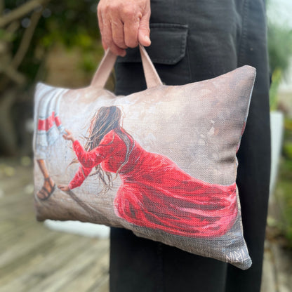 Person holding a pillow with a printed House Of Maria spiritual gift prayer cushion close up

