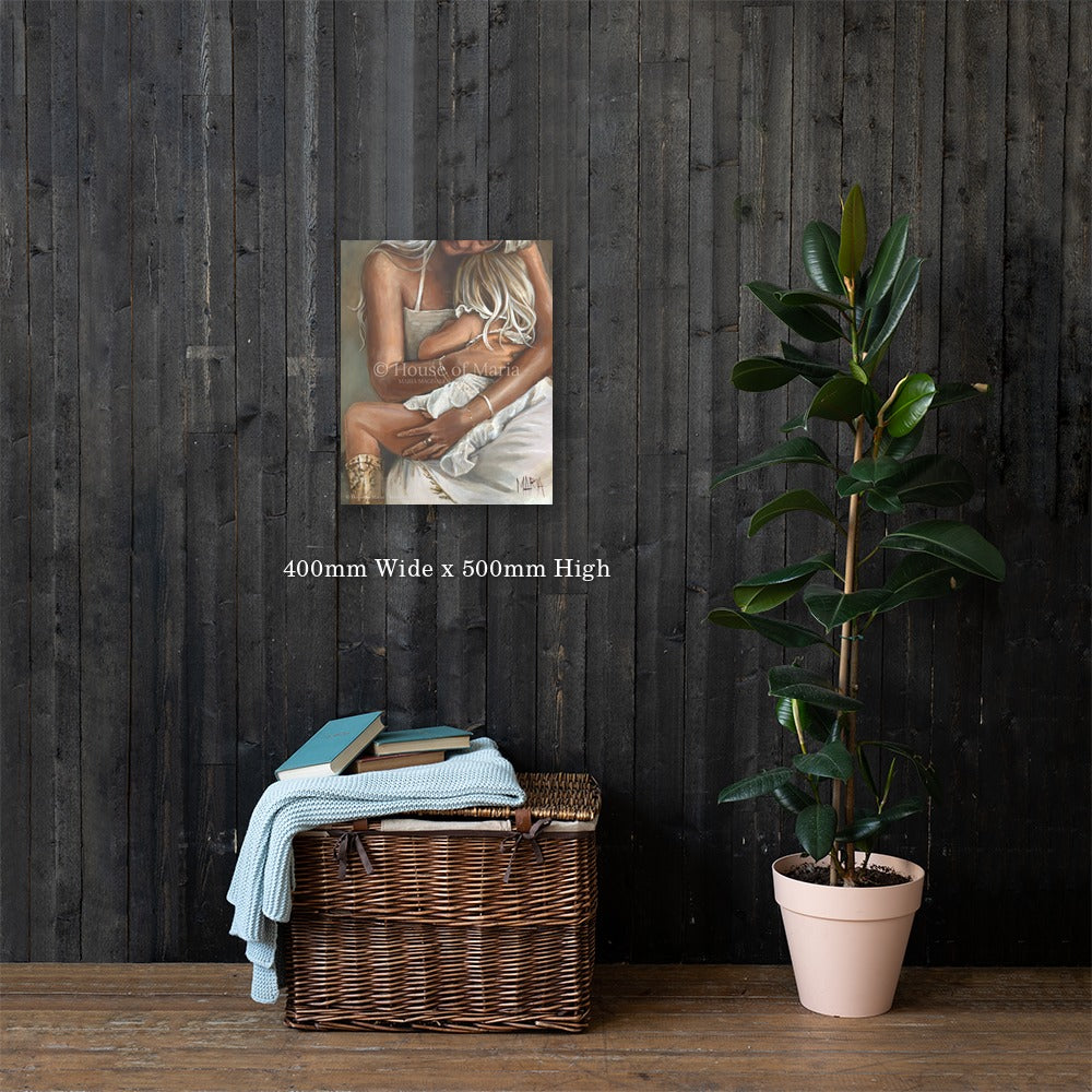 Safe in Her Arms — a mother holding her little girl close on her lap by Maria Magdalena Oosthuizen, 400 x 500mm canvas print on a dark wood wall | canvas print wall art | House of Maria