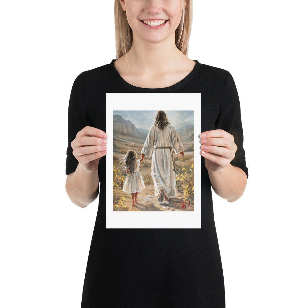 The Way Home — woman holding the A4 print of Jesus leading a little girl home by Maria Magdalena Oosthuizen | South African faith art | House of Maria