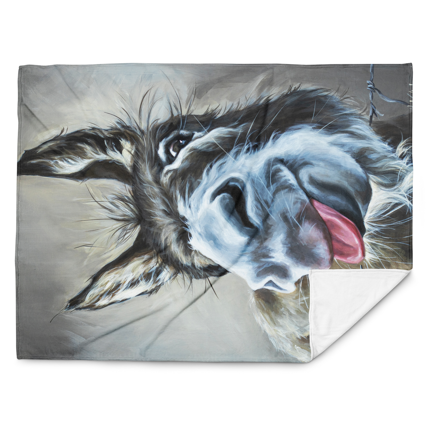 Fleece blanket with a dog's face design on a gray background
